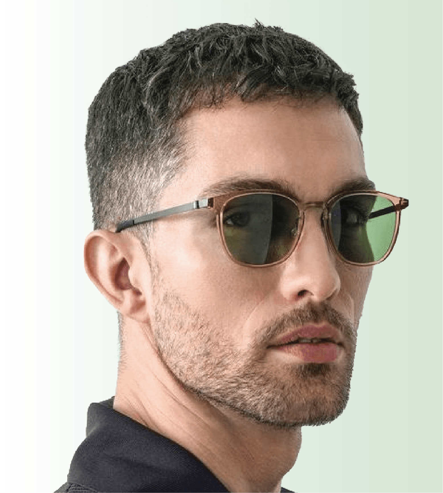 Man wearing sunglasses with green lenses